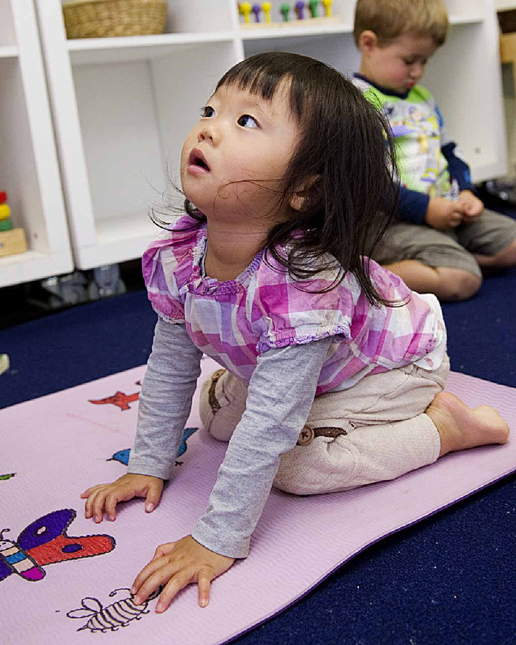 Hanna Soe-Yoshida practises her lion pose during her yoga class at day care. Hanna Soe-Yoshida practises her lion pose during her yoga class at day care.